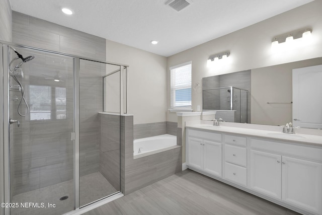251 Dosel Ln, Saint Augustine, FL 32095 - full bathroom featuring a bath, a sink, double vanity, a stall shower, and visible vents