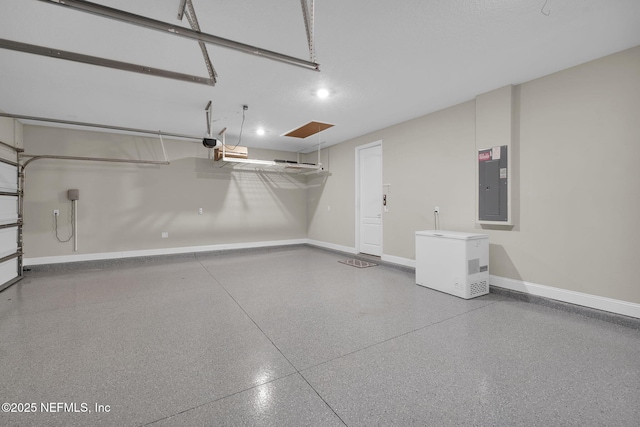 251 Dosel Ln, Saint Augustine, FL 32095 - garage featuring baseboards, electric panel, refrigerator, and a garage door opener