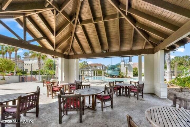 251 Dosel Ln, Saint Augustine, FL 32095 - view of patio with a gazebo, fence, a community pool, and outdoor dining space