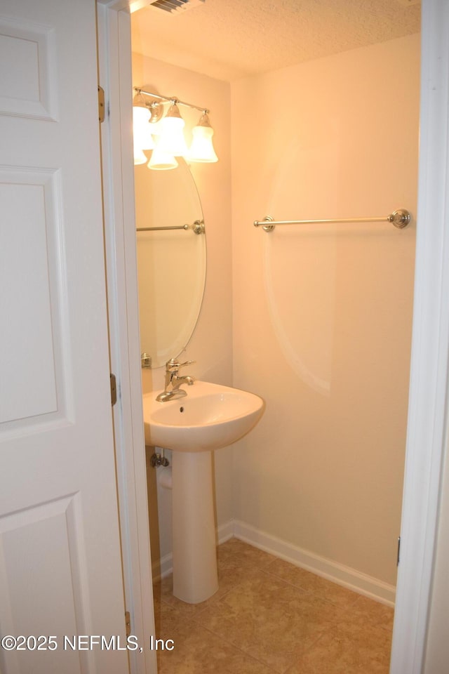8133 Summerside Cir, Jacksonville, FL 32256 - bathroom featuring a sink and baseboards