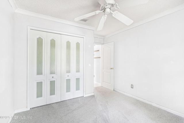 4443 Staple Ct, Middleburg, FL 32068 - unfurnished bedroom featuring carpet, a closet, crown molding, ceiling fan, and baseboards