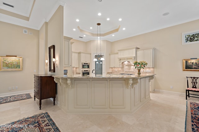 101 Dahlia Ct, Ponte Vedra Beach, FL 32082 - kitchen with ornamental molding, light stone counters, a breakfast bar, a peninsula, and a high ceiling