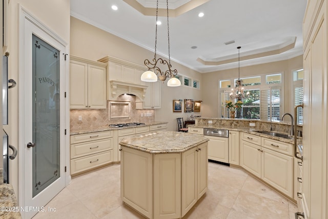 101 Dahlia Ct, Ponte Vedra Beach, FL 32082 - kitchen featuring cream cabinets, a raised ceiling, dishwashing machine, stainless steel gas stovetop, and backsplash