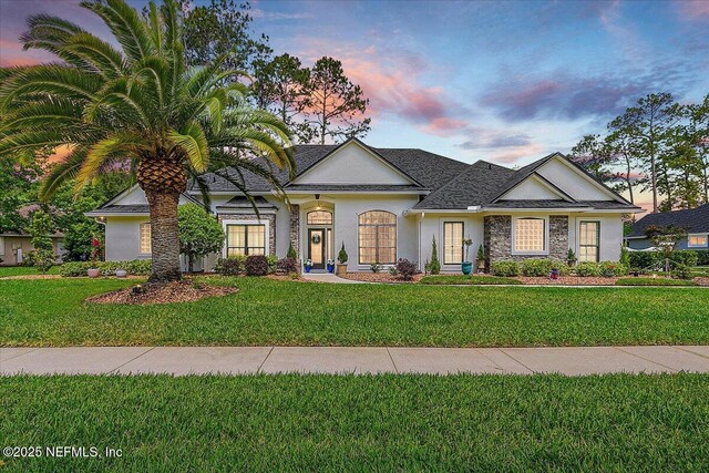 3241 Sequoyah Cir, Saint Johns, FL 32259 - view of front of property with a front lawn, roof with shingles, and stucco siding