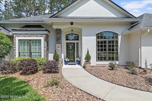 3241 Sequoyah Cir, Saint Johns, FL 32259 - doorway to property with roof with shingles, stucco siding, and stone siding