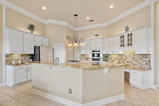 3241 Sequoyah Cir, Saint Johns, FL 32259 - kitchen featuring freestanding refrigerator, light tile patterned flooring, decorative backsplash, and ornamental molding