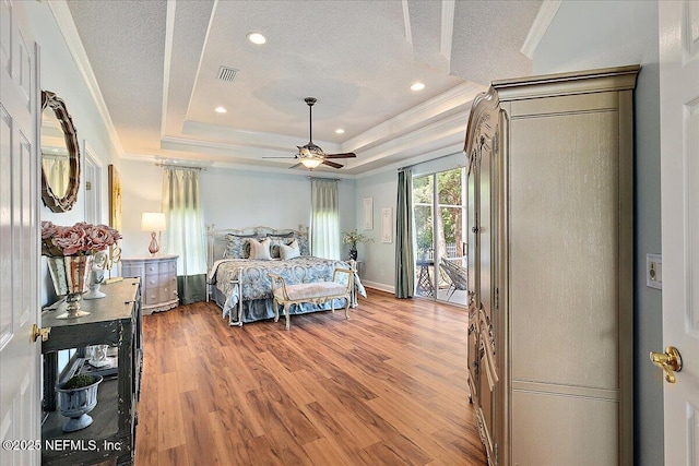 3241 Sequoyah Cir, Saint Johns, FL 32259 - bedroom with access to outside, a tray ceiling, ornamental molding, and a textured ceiling