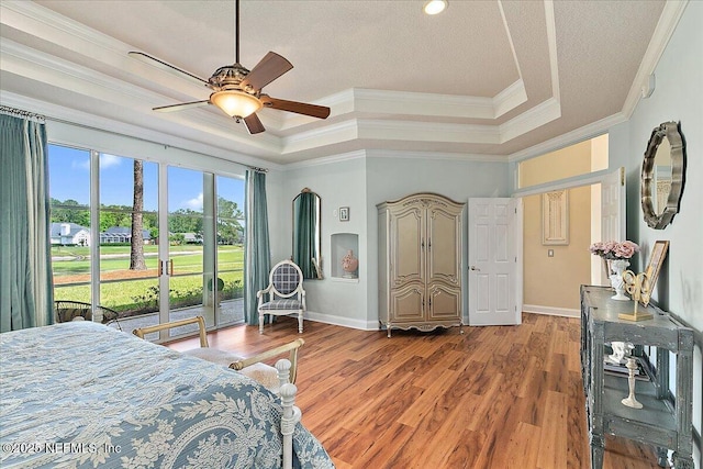 3241 Sequoyah Cir, Saint Johns, FL 32259 - bedroom with a raised ceiling, ornamental molding, baseboards, and wood finished floors