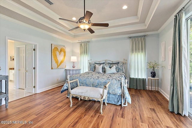 3241 Sequoyah Cir, Saint Johns, FL 32259 - bedroom with crown molding, light wood-style flooring, and a raised ceiling