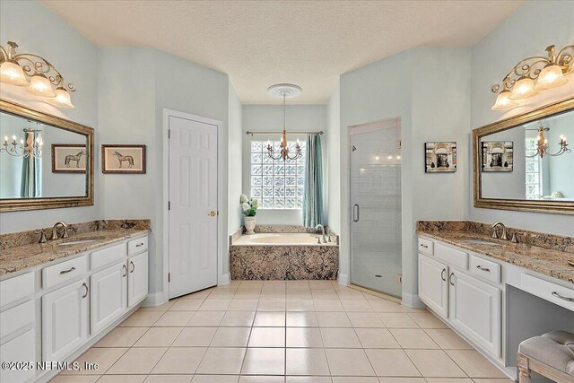 3241 Sequoyah Cir, Saint Johns, FL 32259 - full bathroom featuring an inviting chandelier, a sink, a garden tub, and a stall shower