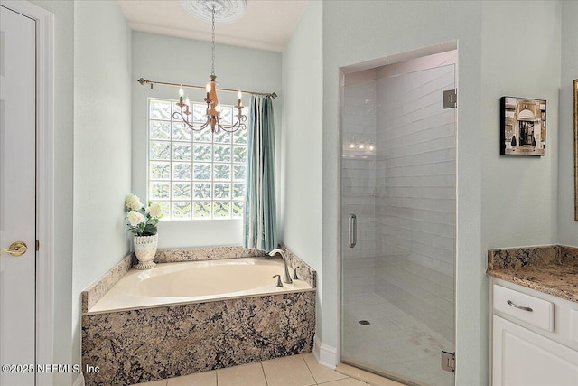 3241 Sequoyah Cir, Saint Johns, FL 32259 - full bathroom featuring tile patterned flooring, a notable chandelier, a shower stall, and a garden tub