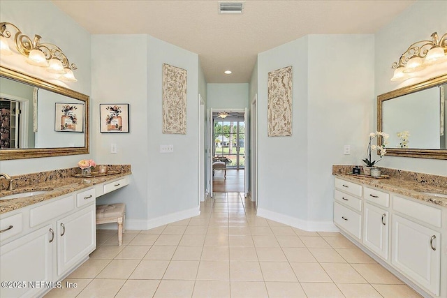 3241 Sequoyah Cir, Saint Johns, FL 32259 - full bathroom with visible vents, tile patterned flooring, two vanities, a sink, and baseboards