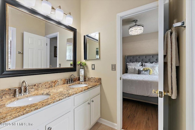 3241 Sequoyah Cir, Saint Johns, FL 32259 - ensuite bathroom featuring baseboards, a sink, ensuite bath, and double vanity
