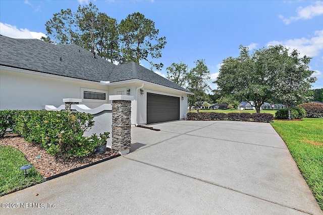 3241 Sequoyah Cir, Saint Johns, FL 32259 - view of side of home featuring a garage, driveway, a shingled roof, and stucco siding