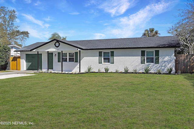 ranch-style home with brick siding, a garage, fence, and driveway