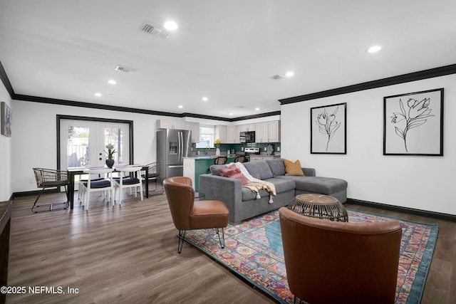 living area with visible vents, ornamental molding, recessed lighting, and french doors