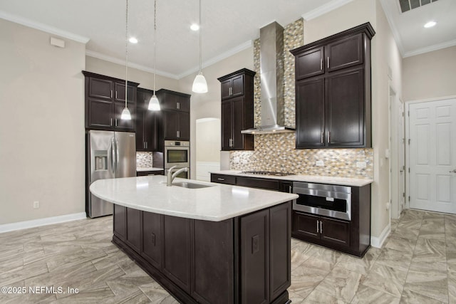 kitchen featuring wall chimney range hood, a sink, marble finish floor, stainless steel appliances, and light countertops
