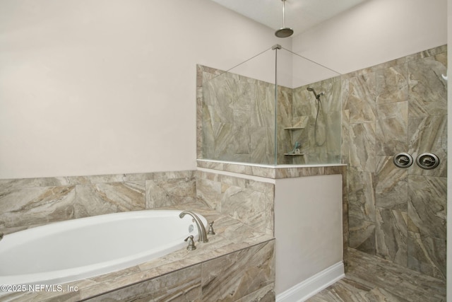 full bathroom featuring a garden tub and walk in shower