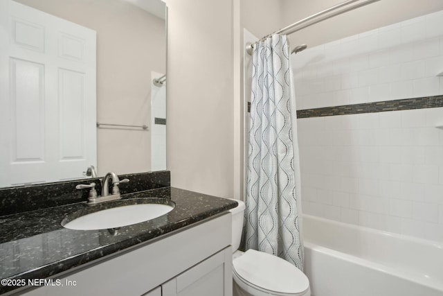 bathroom featuring shower / bath combo with shower curtain, vanity, and toilet