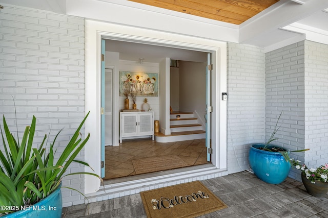 property entrance with brick siding