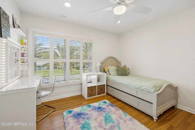 bedroom with recessed lighting, ceiling fan, light wood-style flooring, and baseboards