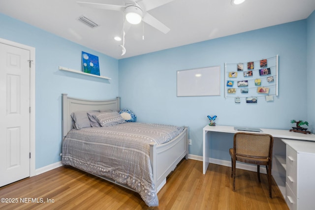 bedroom featuring light wood finished floors, recessed lighting, visible vents, and baseboards