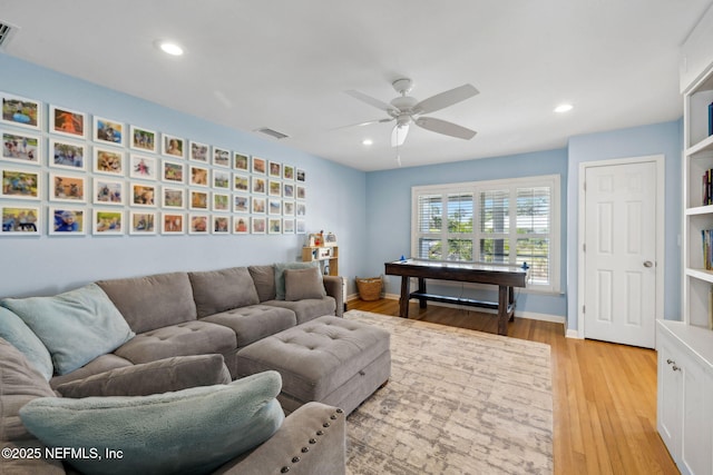 living room featuring visible vents, a ceiling fan, light wood finished floors, and recessed lighting