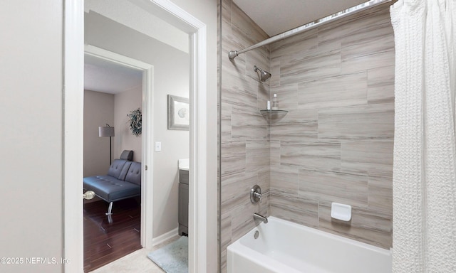 bathroom with shower / bath combo and vanity