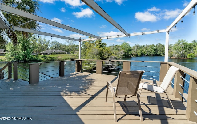 wooden deck featuring a water view