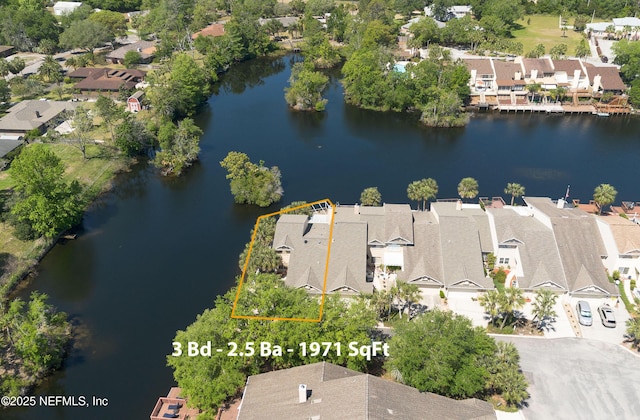 bird's eye view featuring a residential view and a water view