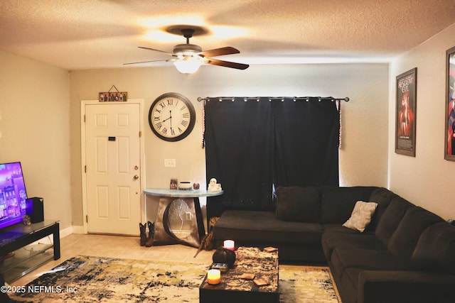 tiled living room featuring a textured ceiling and a ceiling fan