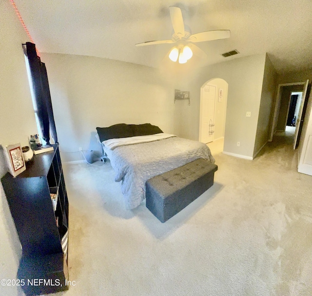 1845 Lago Del Sur Dr, Middleburg, FL 32068 - carpeted bedroom with arched walkways, baseboards, and ceiling fan