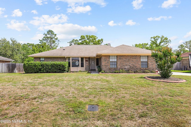 2629 Sandlewood Cir, Orange Park, FL 32065 - ranch-style home featuring a front yard, brick siding, and fence