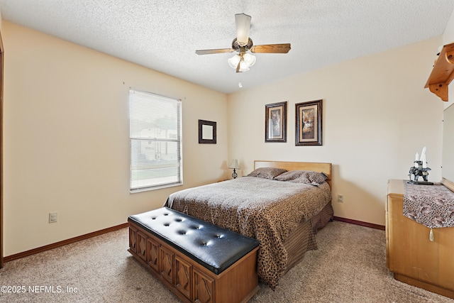 2629 Sandlewood Cir, Orange Park, FL 32065 - bedroom with baseboards, a ceiling fan, a textured ceiling, and light colored carpet