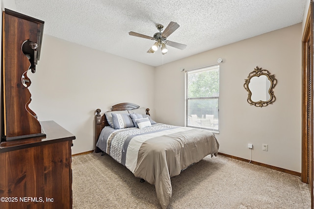 2629 Sandlewood Cir, Orange Park, FL 32065 - bedroom featuring baseboards, a ceiling fan, light carpet, and a textured ceiling