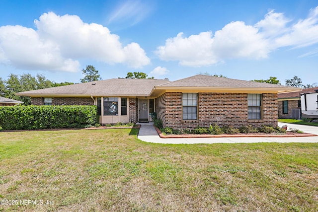 2629 Sandlewood Cir, Orange Park, FL 32065 - single story home featuring a front lawn and brick siding