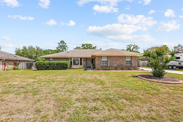 2629 Sandlewood Cir, Orange Park, FL 32065 - ranch-style home featuring a front lawn, brick siding, and fence