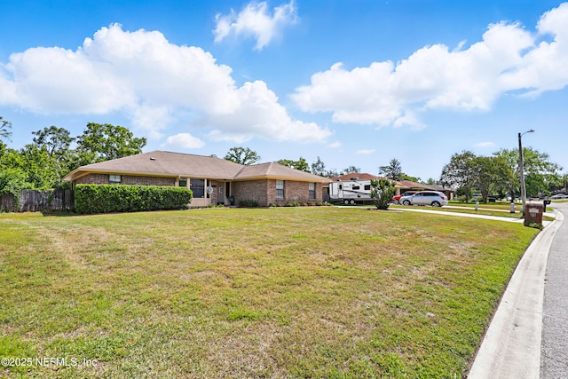 2629 Sandlewood Cir, Orange Park, FL 32065 - single story home with a front yard, brick siding, and fence