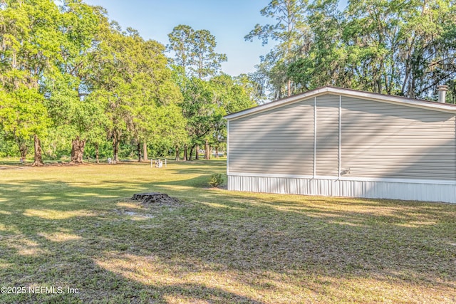 view of home's exterior featuring a yard