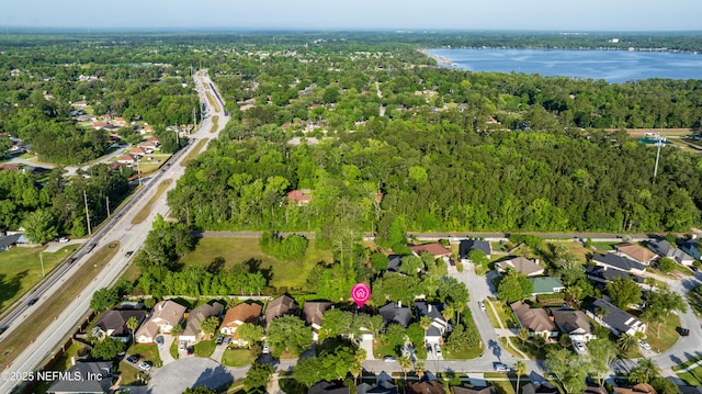 1884 Lake Forest Ln, Fleming Island, FL 32003 - bird's eye view featuring a forest view, a water view, and a residential view