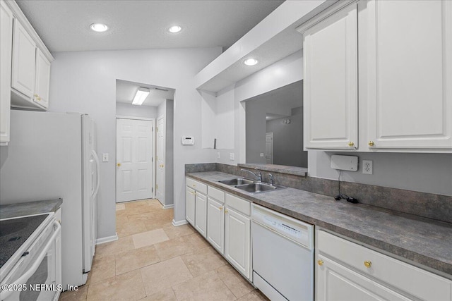 1884 Lake Forest Ln, Fleming Island, FL 32003 - kitchen with recessed lighting, white cabinets, dark countertops, a sink, and white appliances