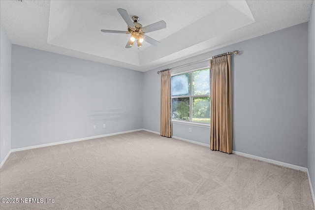 1884 Lake Forest Ln, Fleming Island, FL 32003 - unfurnished room with a ceiling fan, baseboards, carpet, and a raised ceiling