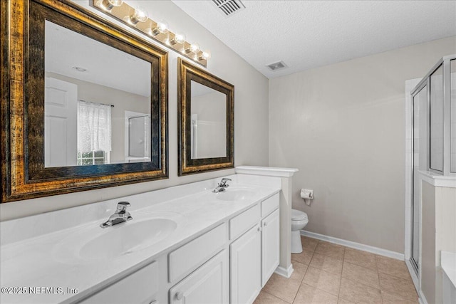 1884 Lake Forest Ln, Fleming Island, FL 32003 - bathroom with toilet, a sink, visible vents, and a stall shower