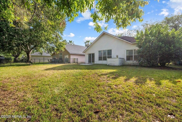 1884 Lake Forest Ln, Fleming Island, FL 32003 - rear view of house with fence and a yard