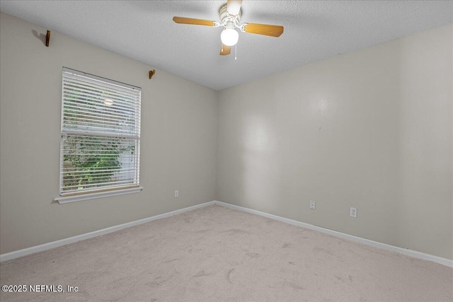 1884 Lake Forest Ln, Fleming Island, FL 32003 - spare room featuring baseboards, a ceiling fan, a textured ceiling, and carpet