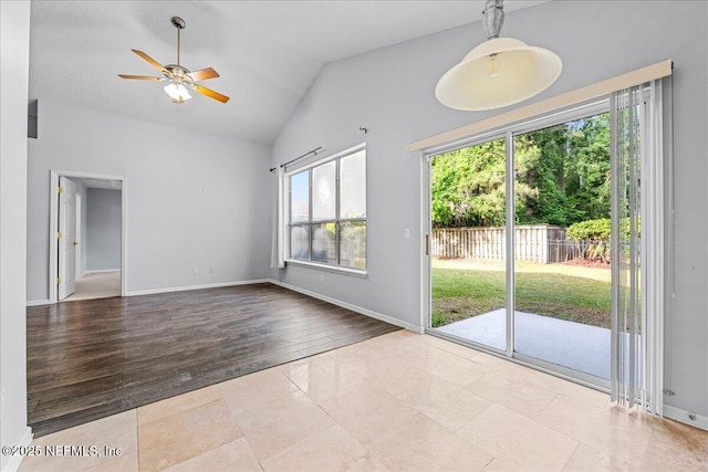 1884 Lake Forest Ln, Fleming Island, FL 32003 - unfurnished living room featuring ceiling fan, lofted ceiling, wood finished floors, and baseboards
