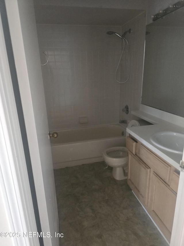 bathroom with shower / washtub combination, vanity, tile patterned floors, and toilet
