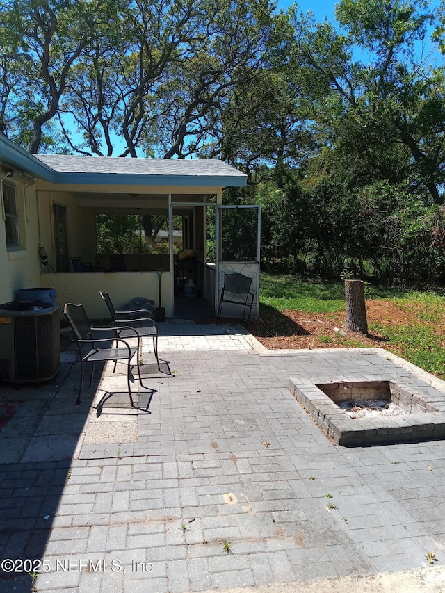 274 Hermosa Ct, Saint Augustine, FL 32086 - view of patio featuring an outdoor fire pit and cooling unit
