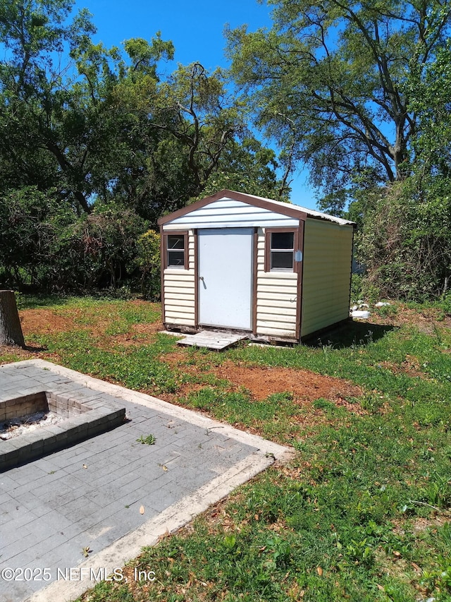 274 Hermosa Ct, Saint Augustine, FL 32086 - view of shed with a fire pit