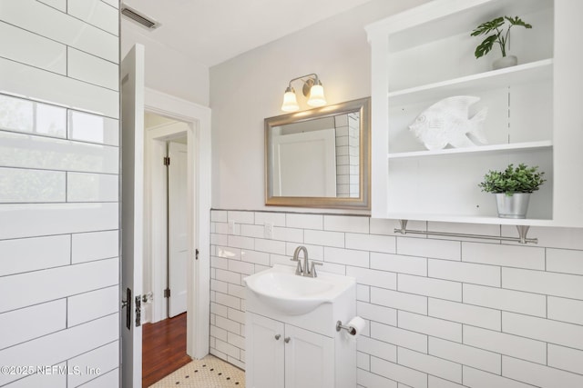 bathroom featuring visible vents and vanity